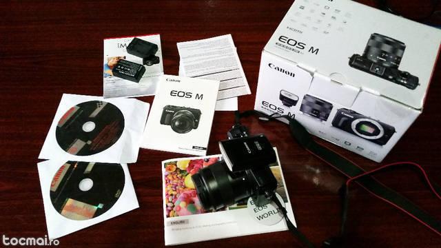 Canon EOS- M + 18- 55mm + blitz( nou+2 baterii extra)